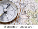 stock-photo-compass-and-map-386559937.jpg