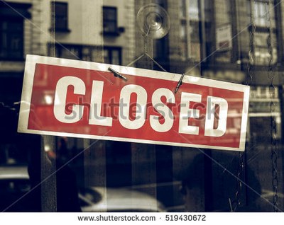 stock-photo-vintage-looking-closed-sign-in-a-shop-showroom-with-reflections-519430672.jpg